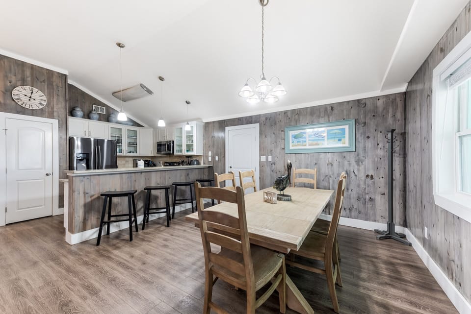 Enjoy hanging out with the group at the dining room table! - The kitchen is right next to the dining room for accessibility! Gather the gang around the table for meals, game time, or good old-fashioned conversation.