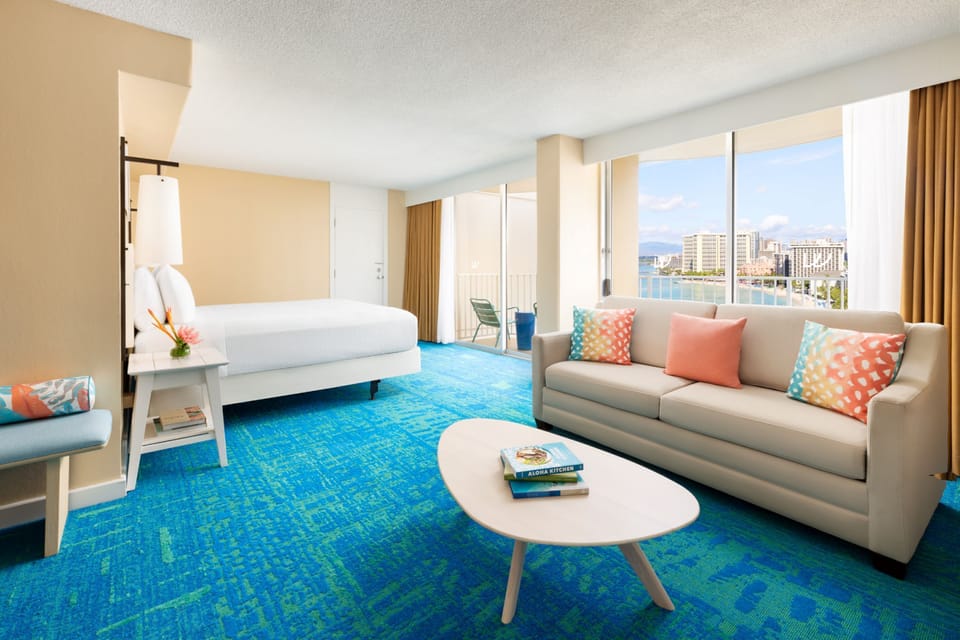 Lounge in a sunlit living space with panoramic waterfront views.