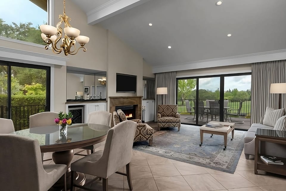 Gather and relax by the fireplace with scenic outdoor views.