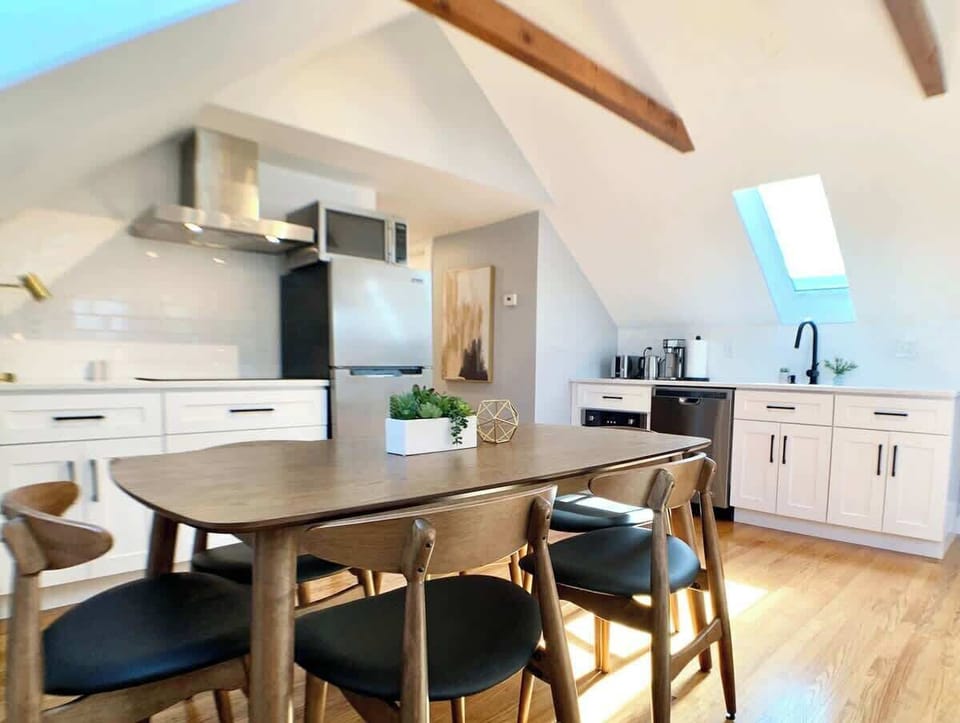 Dining and kitchen area point of view. 
New appliances, including Induction electric stove with powerful range hood, convection oven, etc. 