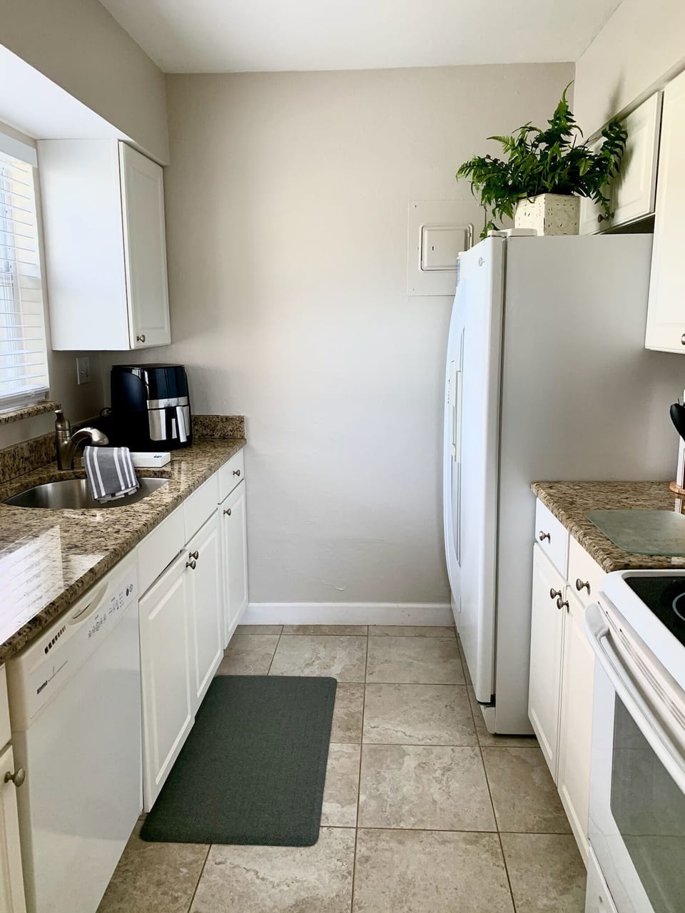 Kitchen- stocked with pots and pans for cooking, along with many extras