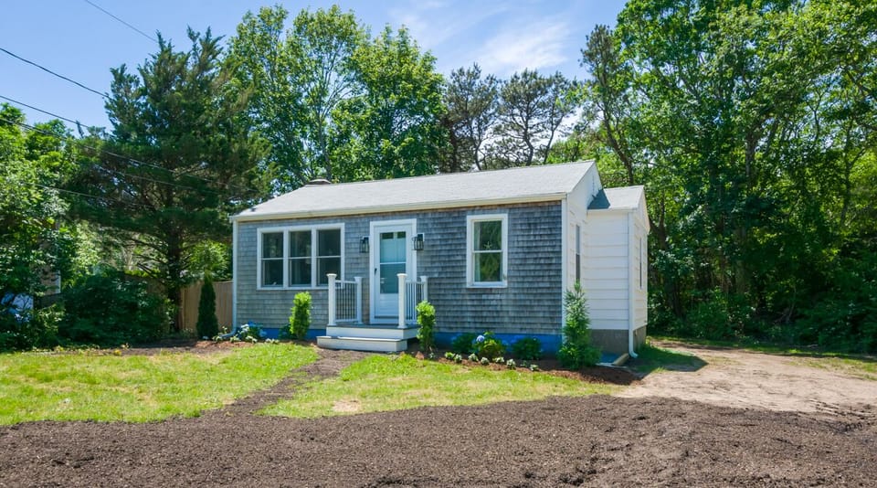 Front of the home. Fence to keep small dog contained new in summer 2024