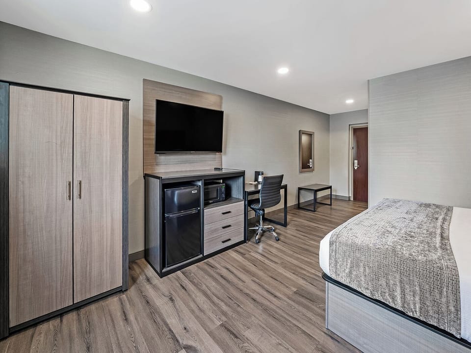 Settle in comfortably with desk workspace and handy mini-fridge.