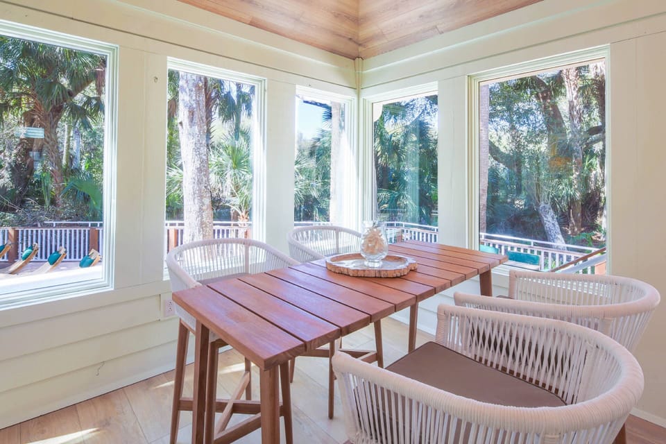 This table in the sunroom is the perfect spot for a board game with your family.