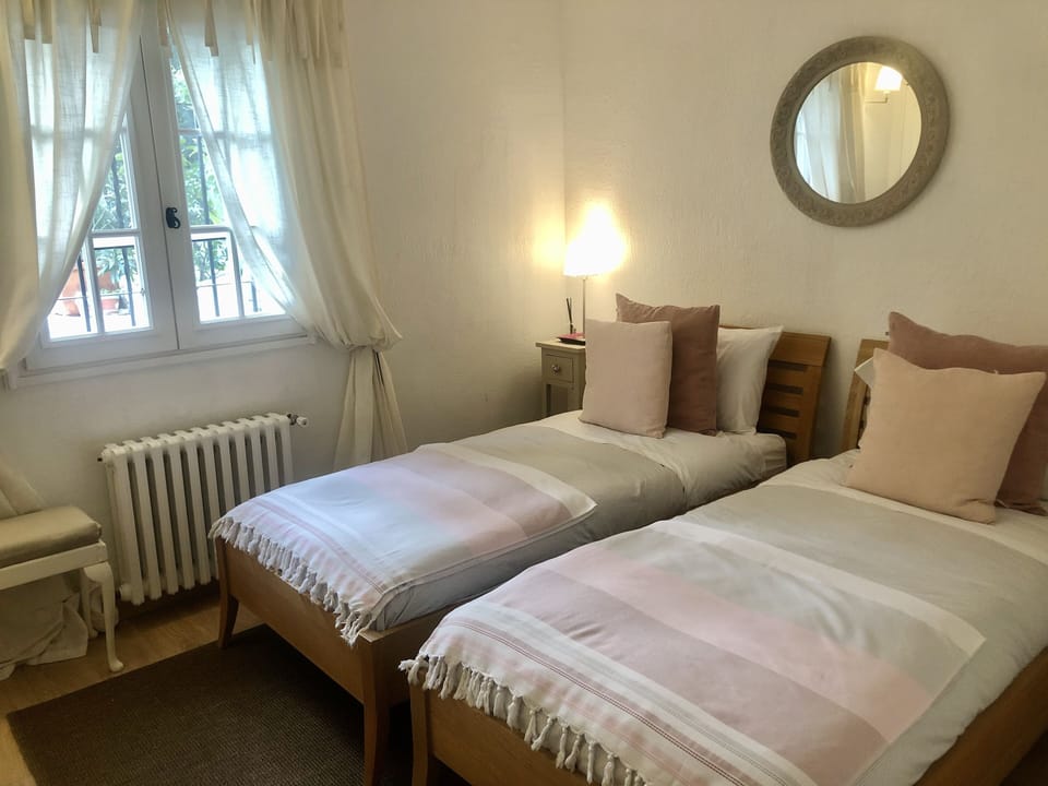 Twin single beds in third bedroom