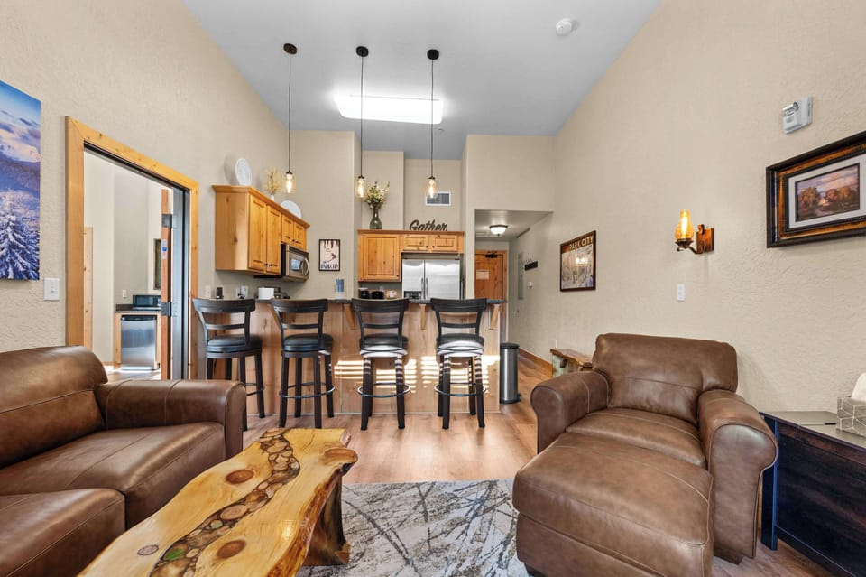 Main living space: Open layout, well-equipped kitchen, living room, queen pull-out bed and a Super Sleeper mattress topper, 48” Smart TV, electric fireplace
