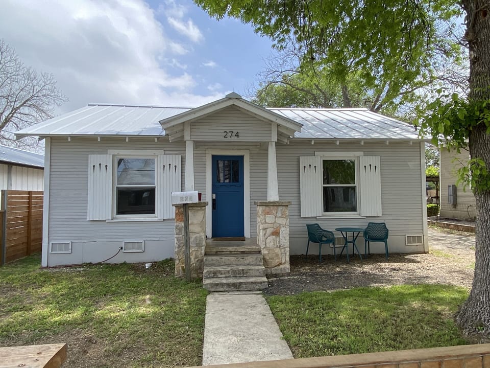 Front view with bistro table to enjoy morning coffee.