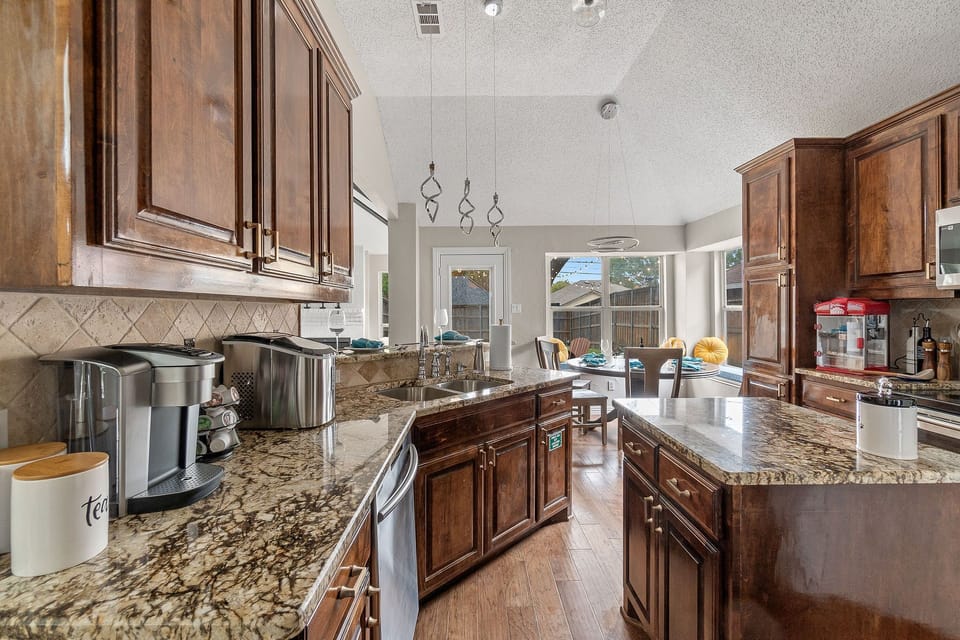 Granite counter tops with plenty of space for coffee, cooking, baking needs. 