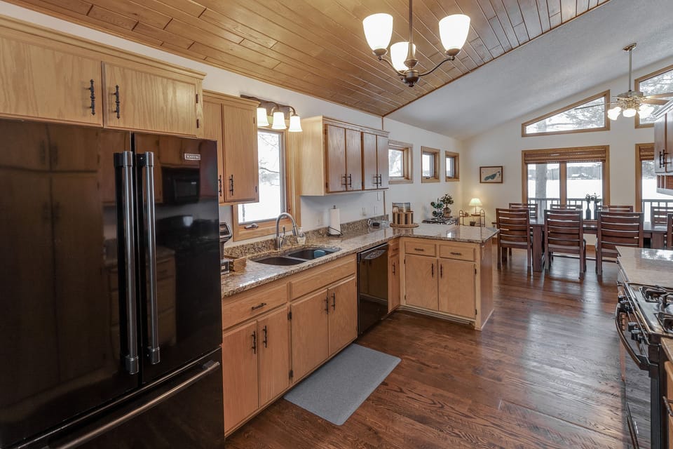 Kitchen with granite counter tops, open and light filled