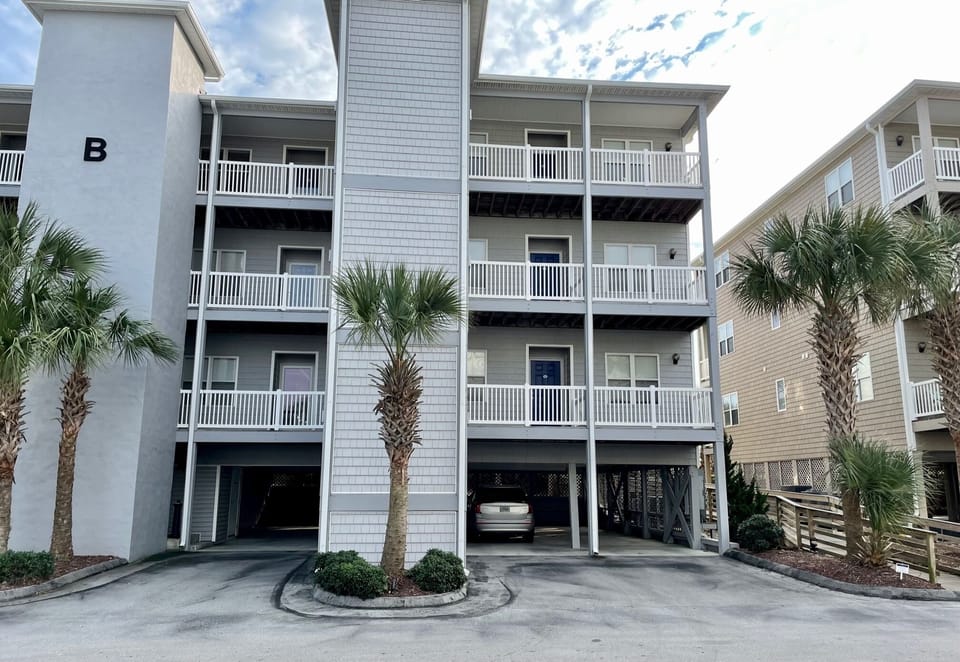 Our building B - parking, steps, elevator and boardwalk to the pool and beach