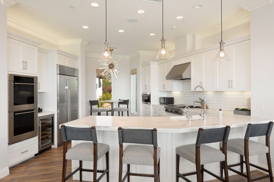 Kitchen featuring Subzero, Wolf ovens, Wolf gas range, wine refrigerator