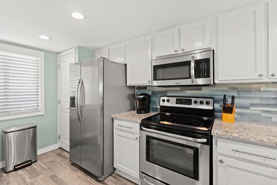 Gorgeous updated kitchen. Granite counters, stainless steel appliances, & fully-stocked for your stay.