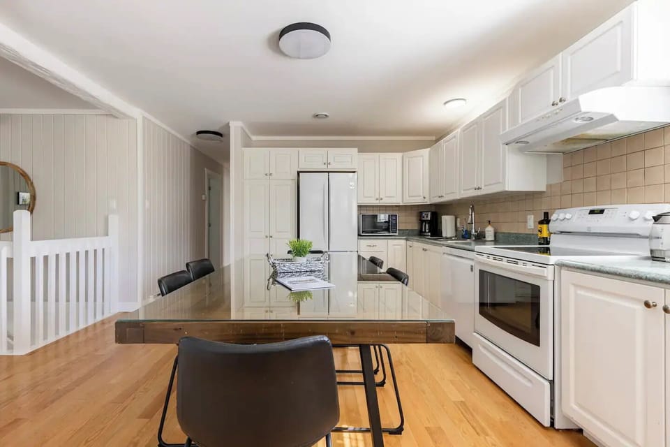 Large kitchen fully stocked with dishwasher, microwave, coffee maker etc