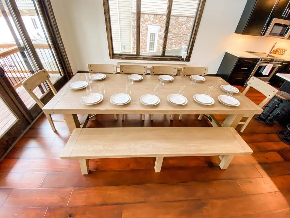 Welcome to our beautiful open-concept kitchen and dining area, the heart of our stunning vacation home. The spacious dining table is the perfect gathering place for family and friends to enjoy meals and make memories together.