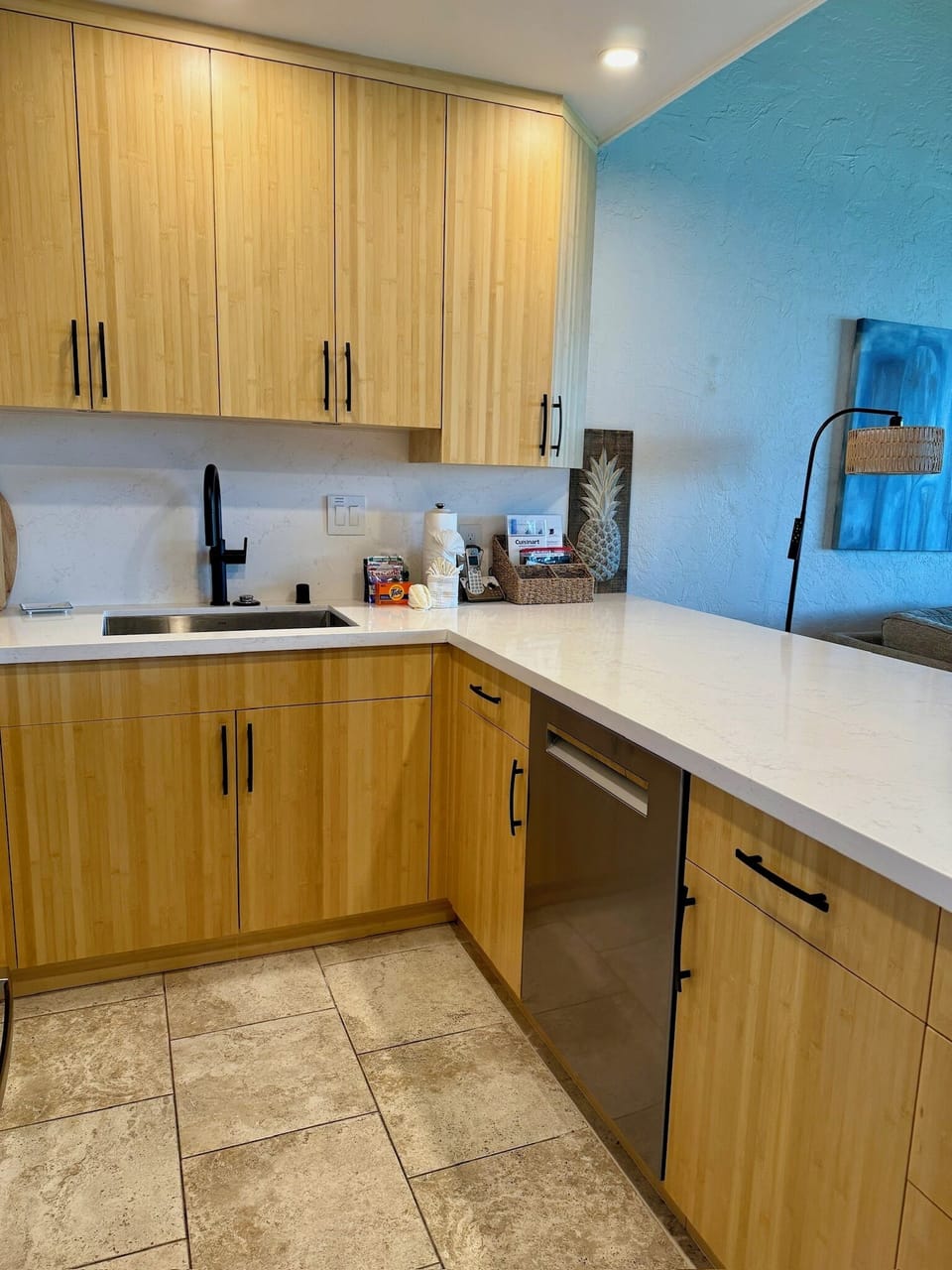 Bamboo cabinets and quartz countertops.