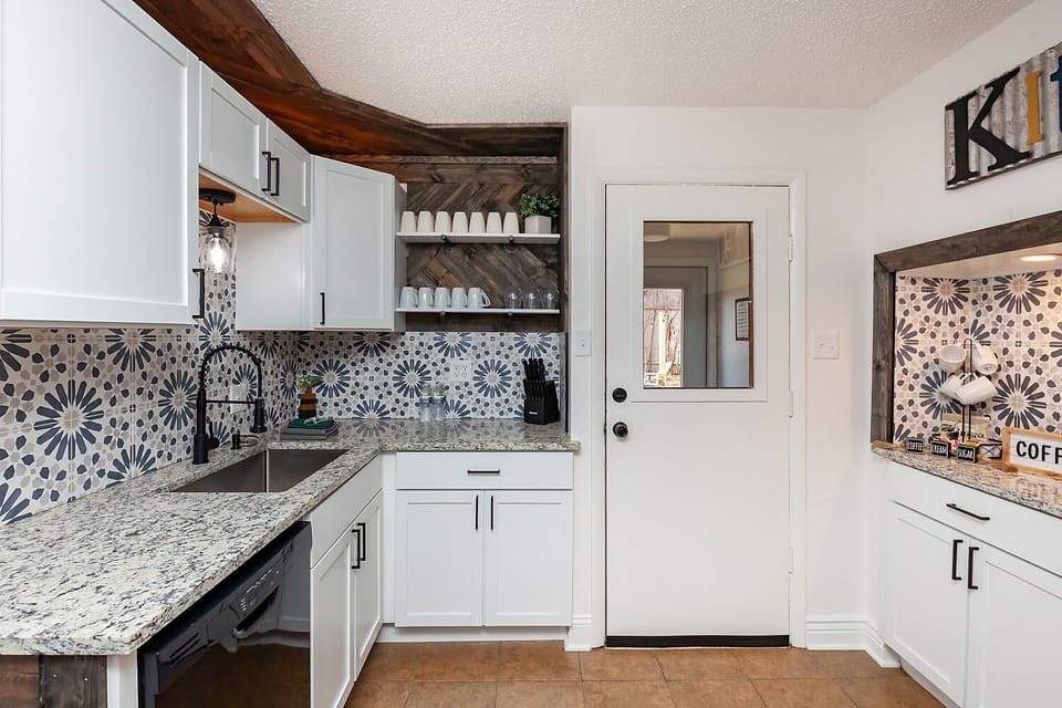 Fully stocked kitchen with most everything you could need. Leads to back deck