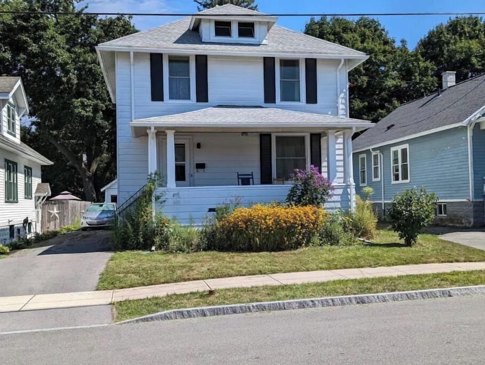 Front view.  Driveway is to the left of the house.