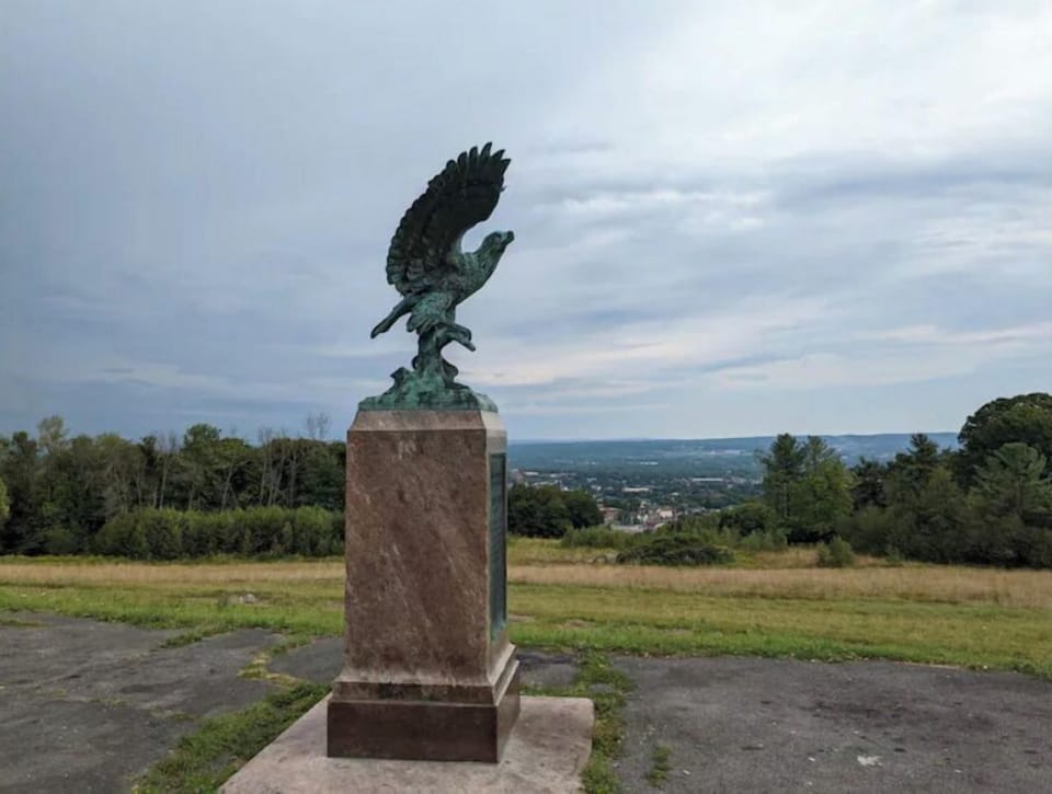 "The Eagle" at the top of the hill overlooks Utica and the area below. 