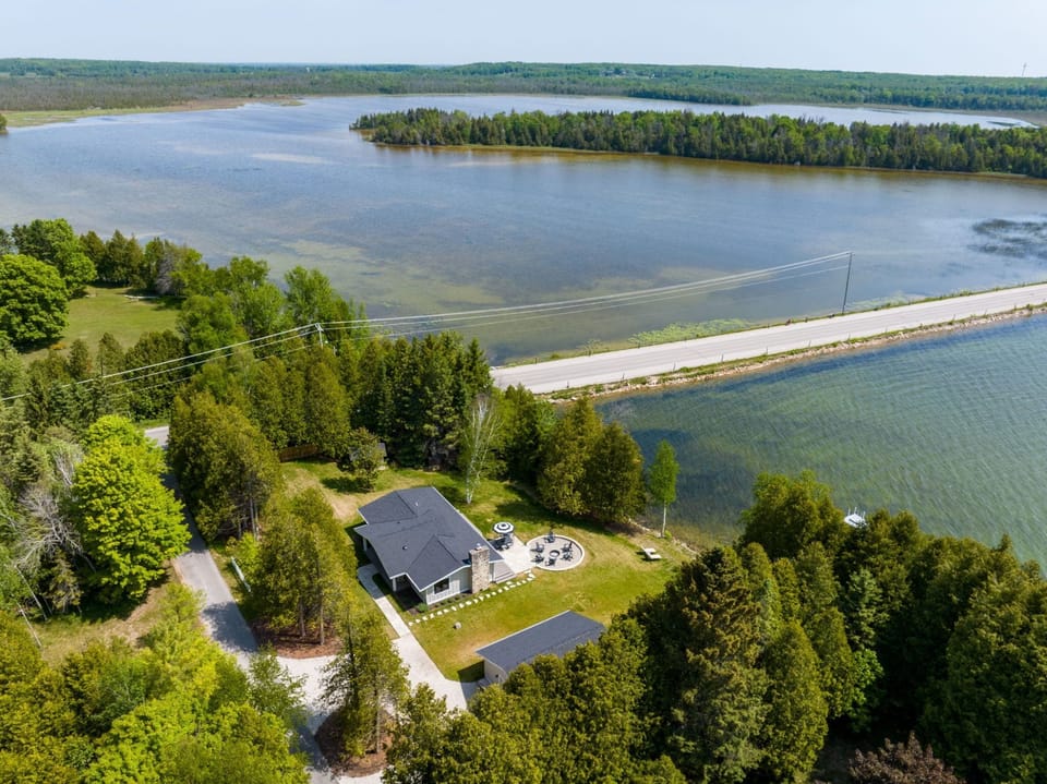 Our home borders the historic Kangaroo Lake causeway, a beloved area in Door County.