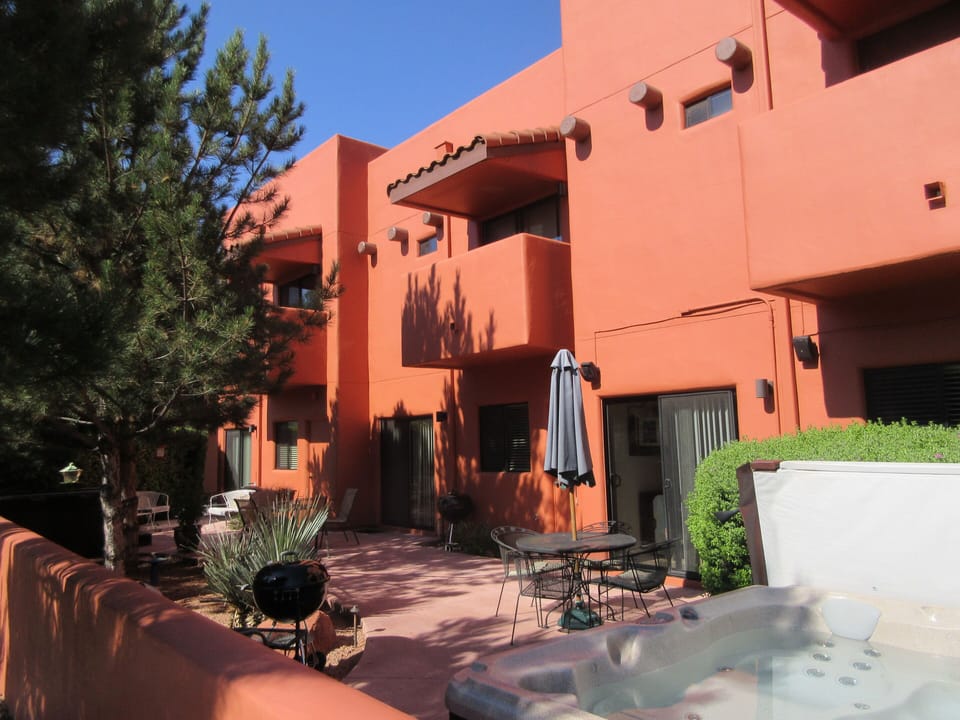 Back patio with 2 hot tubs