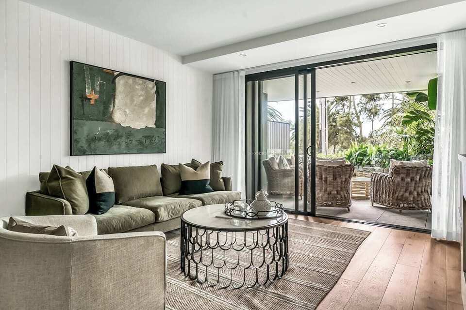 Living area leads to the large balcony with stunning planting.