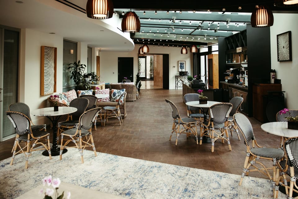 Gather for coffee and conversation beneath warm ambient lighting.