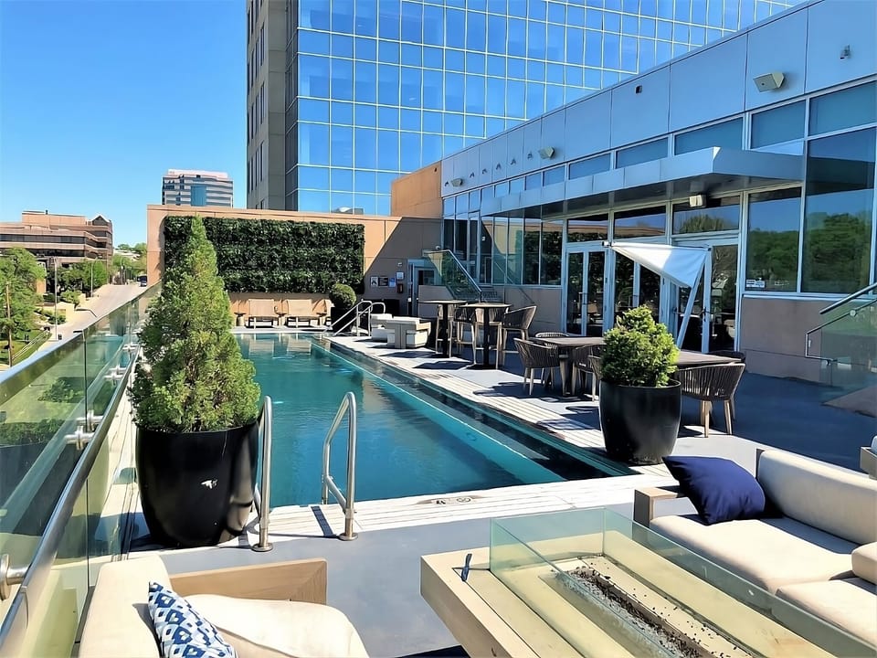Soak up sunshine beside the sleek rooftop pool and loungers.