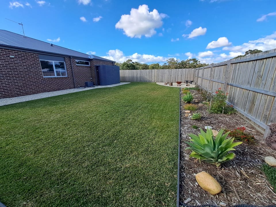 Fully fenced backyard for the kids to play