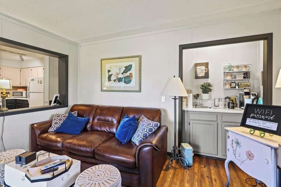 Relax on our comfy sofa with pillows, enjoy a 50" Roku TV, gather around a stylish coffee table, and feel the warmth of an indoor fireplace. Your ideal retreat.