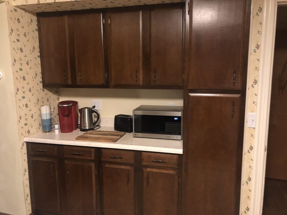 Well appointed kitchen with microwave, Keurig, hot water pot, toaster, and more.