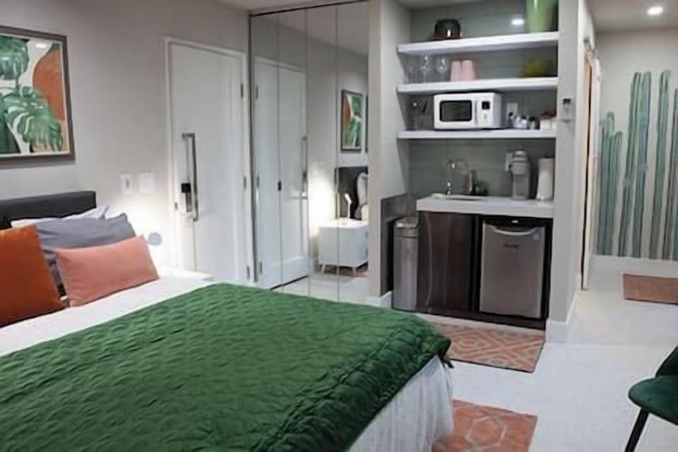 Start your day with the convenience of a coffee bar and kitchenette, equipped with a mini fridge, microwave, and sink.