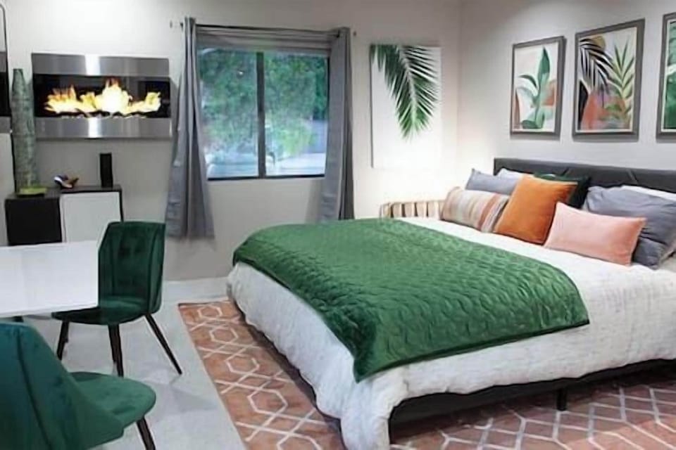 Unwind in a plush king bed with luxurious linens, designed to provide a restful and rejuvenating sleep.
