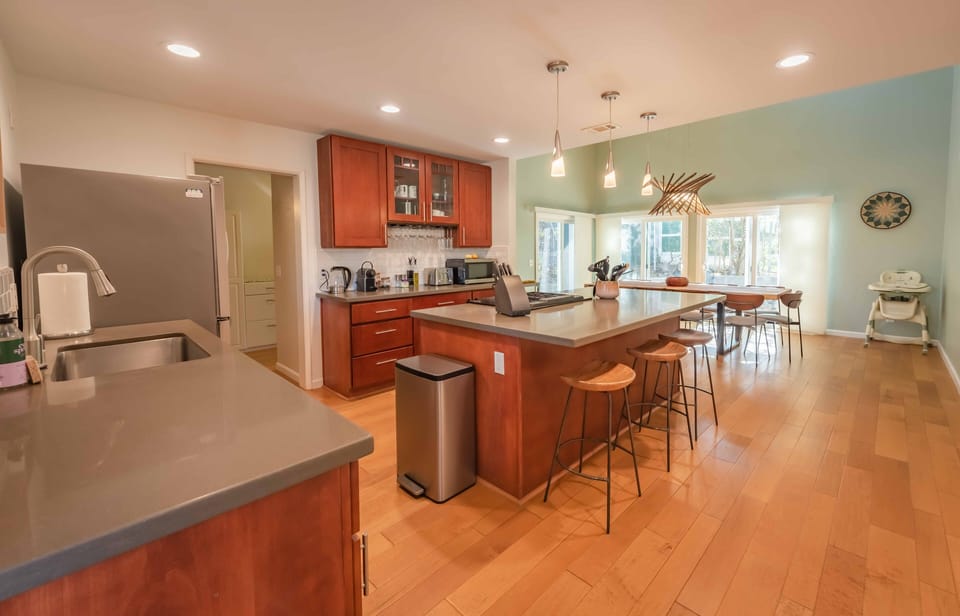 Kitchen with island and barstools