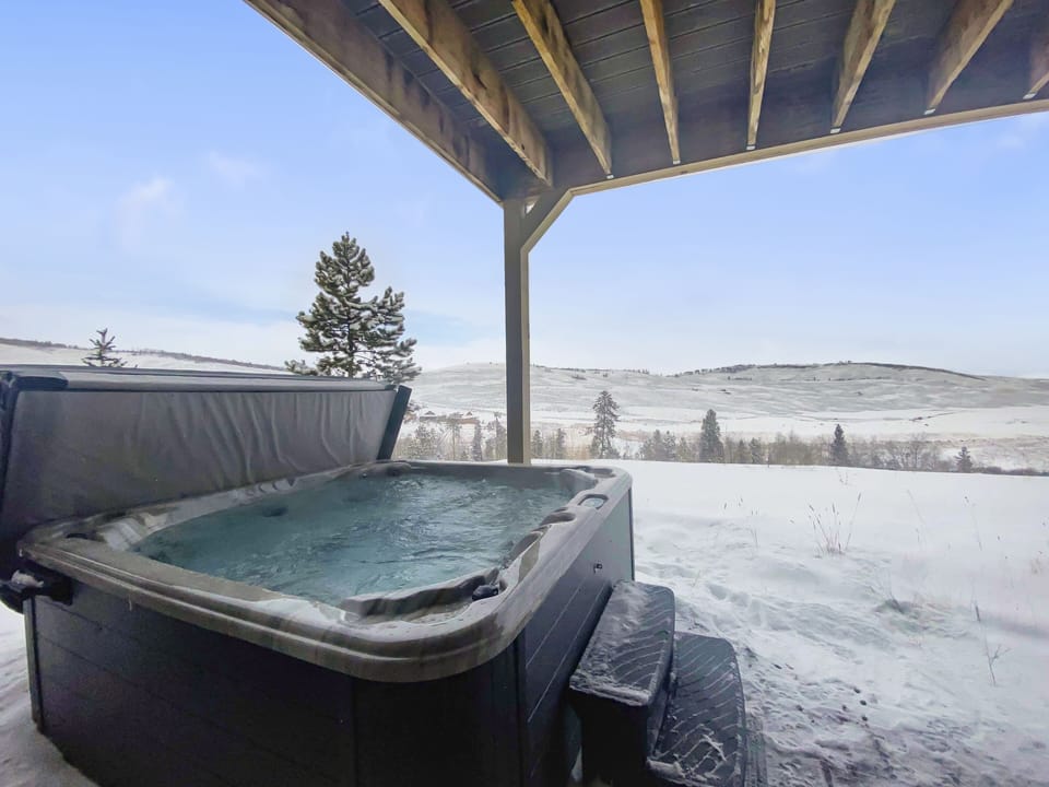 - Private hot tub with snowy mountain scenery around   - Relaxing soak spot after skiing or outdoor activities   - Covered patio makes it usable in every season stay