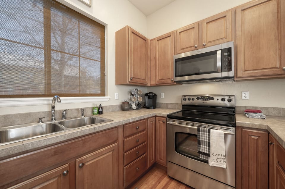 - Open concept living with vaulted ceilings and exposed beams   - Kitchen bar seating flows into dining and lounge areas   - Ideal layout for entertaining after mountain adventures