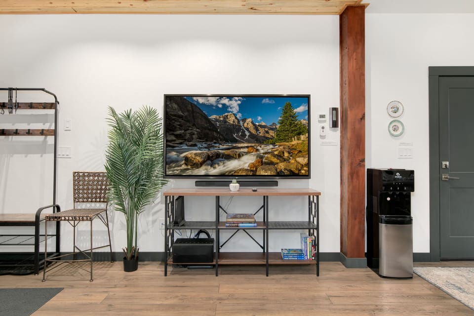 First floor with 4K TV and entrance to attached garage