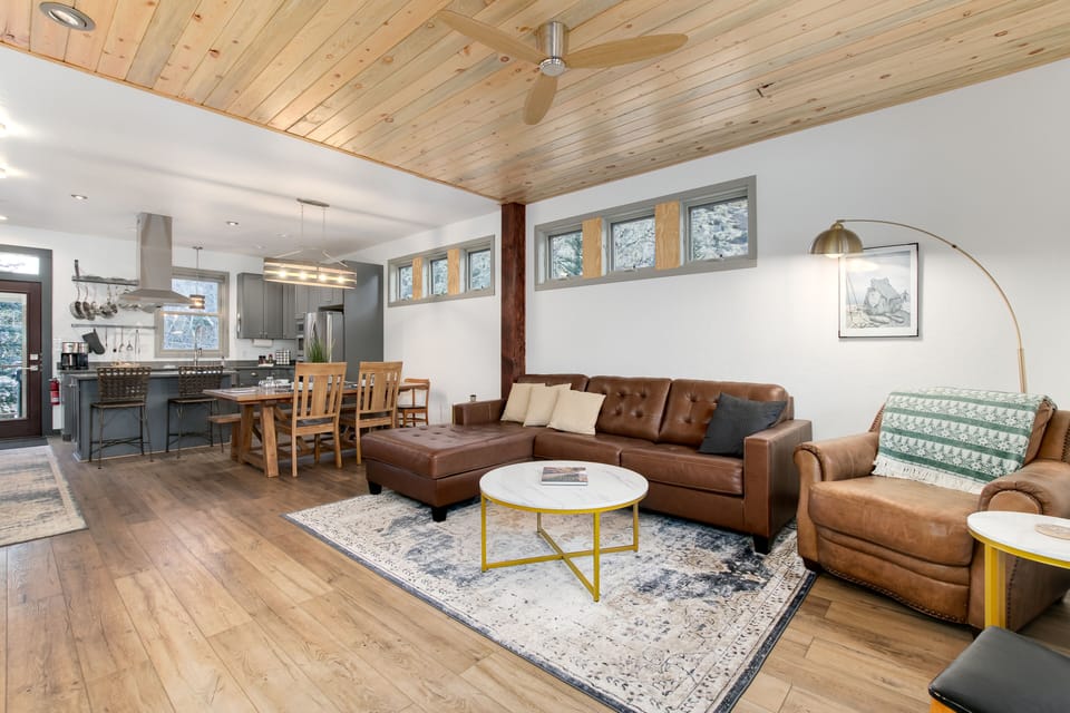 Open concept main floor living area, dining, and kitchen