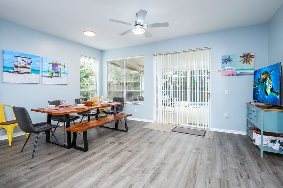 Dining Area with TV and views out to the pool area