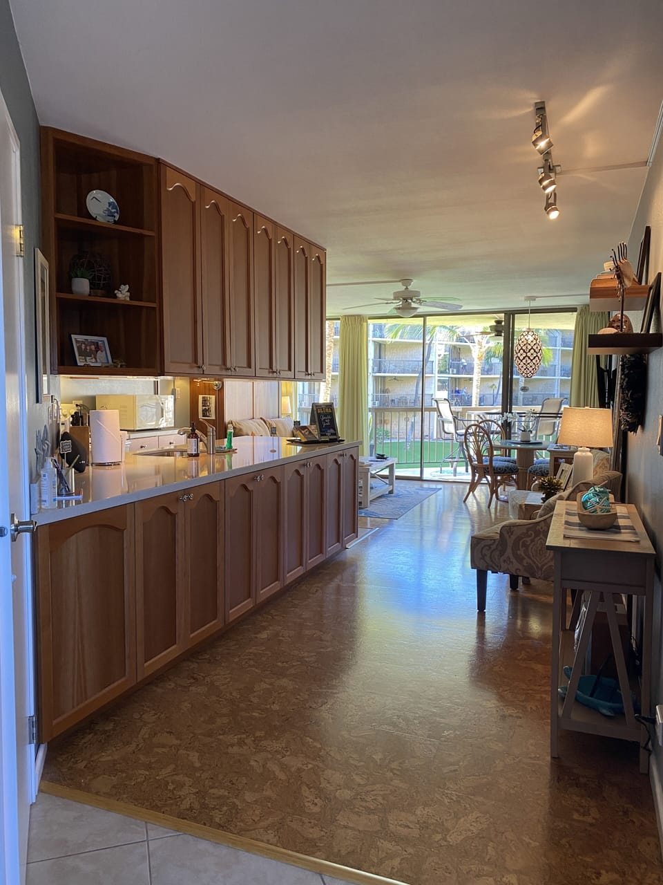 Full view of kitchen and living area with views of the garden from the lanai
