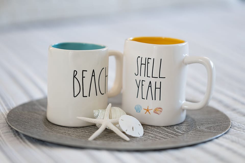 Condo features Rae Dunn mugs with the perfect wording