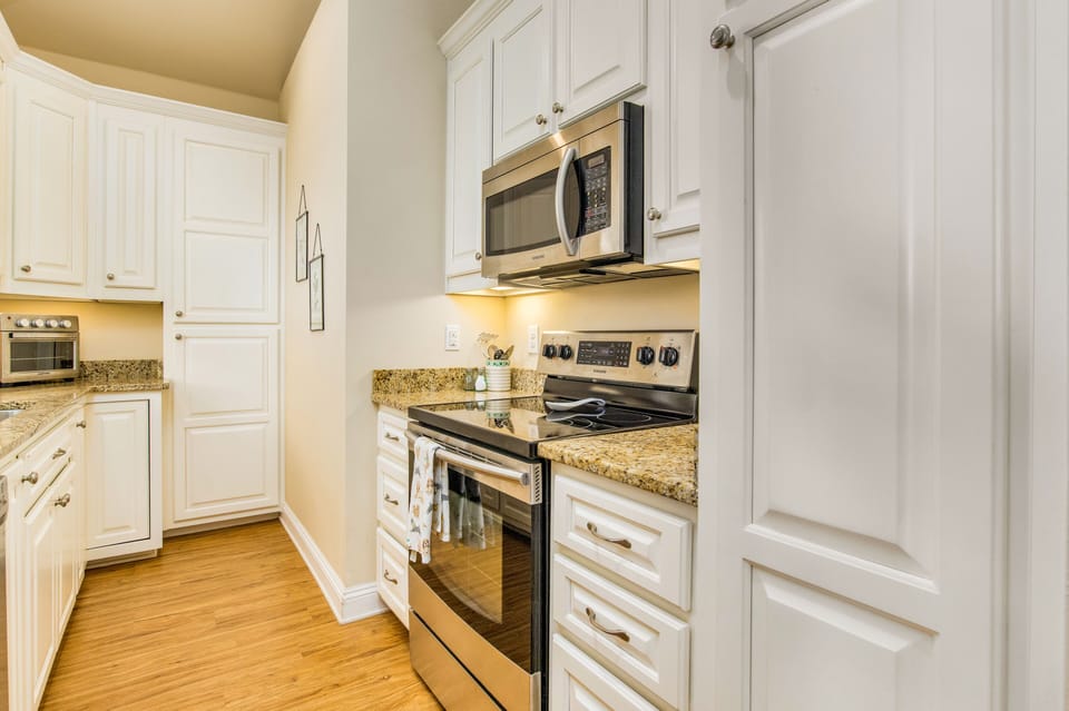 Microwave and stove for your cooking convenience.