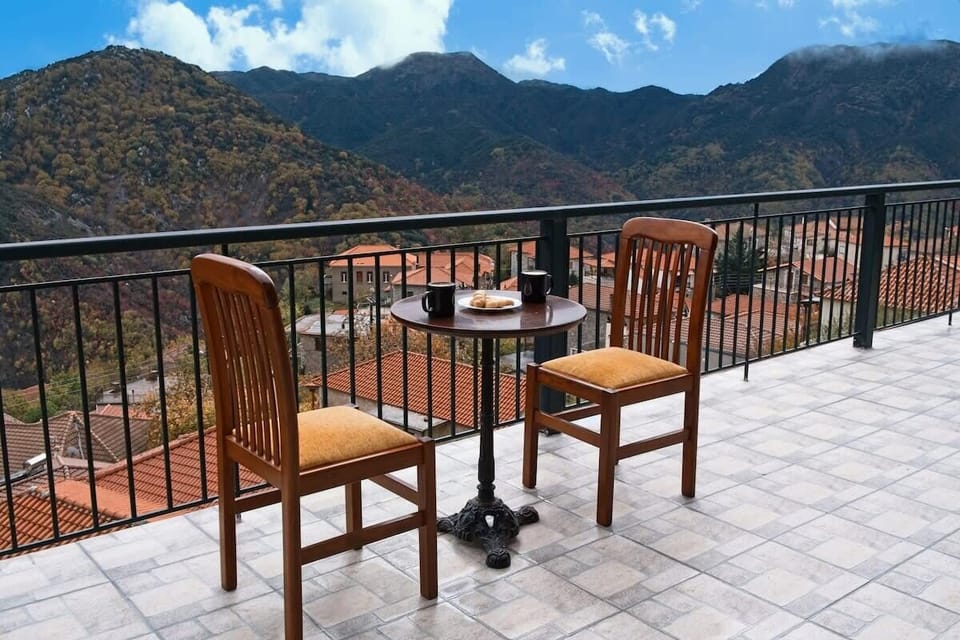 Balcony View from the Property – Peaceful outdoor space offering panoramic mountain and valley views.