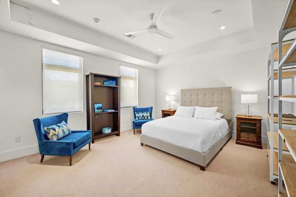 The fifth guest room includes a king bed and stylish decor, providing a serene and comfortable stay in your Hawaii vacation home.