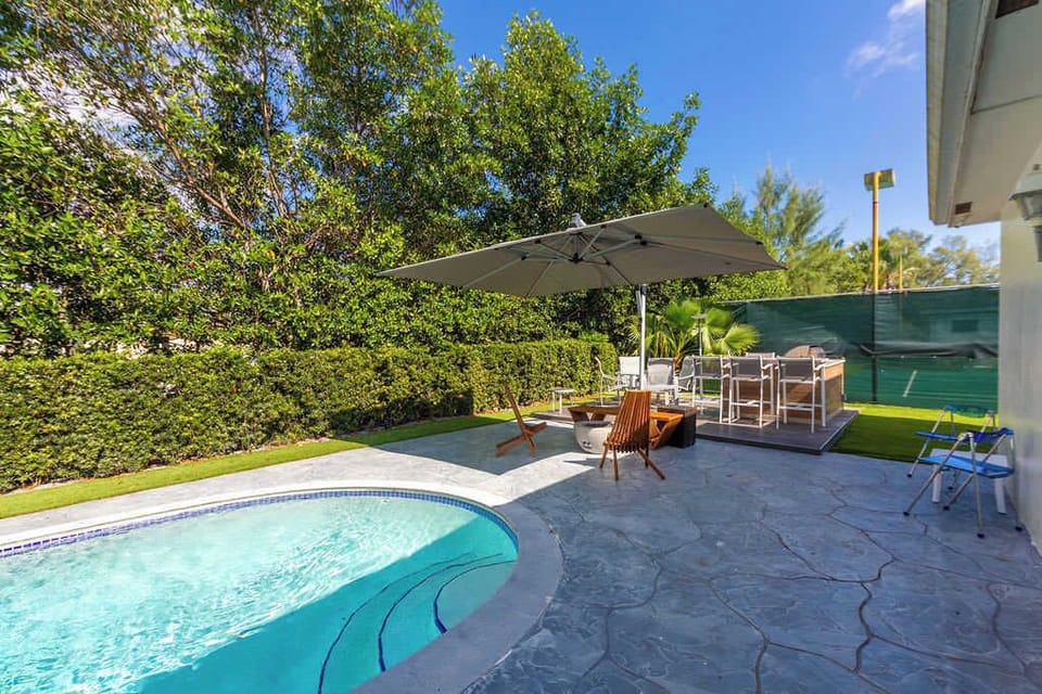 Terrace and fire pit next to the sparkling heated pool.