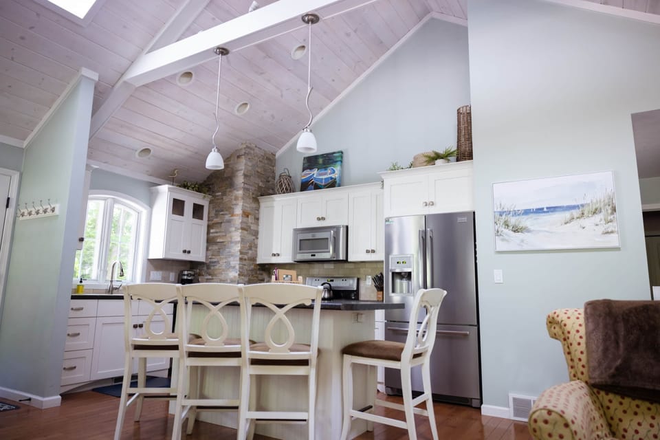Fully stocked kitchen with modern stainless appliances and ample room for cooking and entertaining.