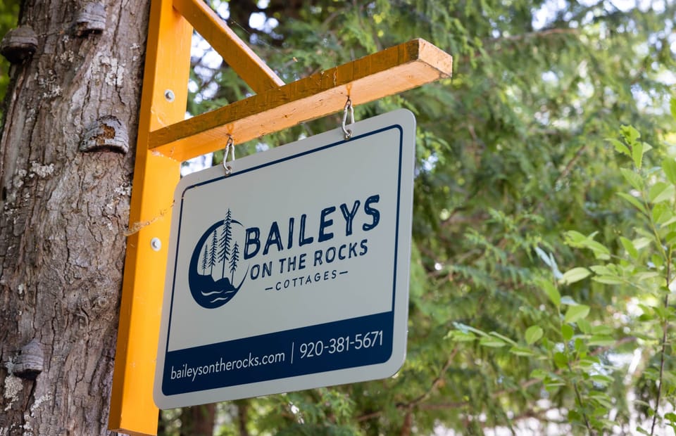 Baileys on the Rocks Cottages front sign.