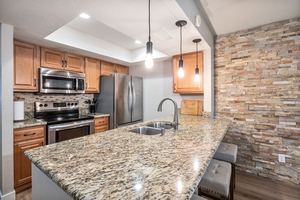 Full kitchen with everything you need including four barstools at island