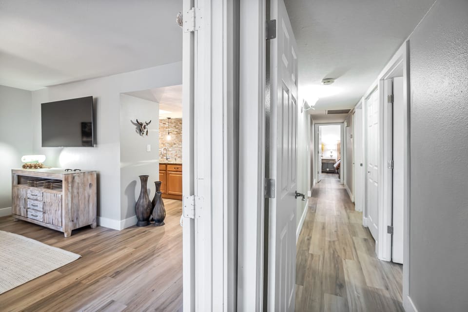 Hall way to bedrooms and french doors to family room