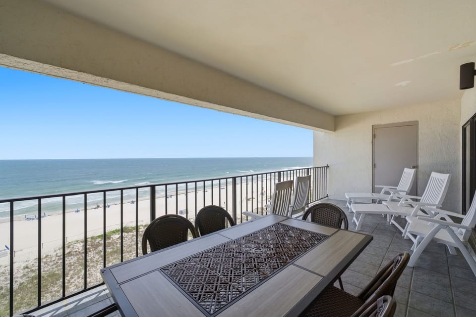 Shipwatch D803- Spacious balcony with unobstructed ocean views, offering ample seating for outdoor dining and relaxation. Watch the waves, feel the sea breeze, and unwind in your private coastal retreat.