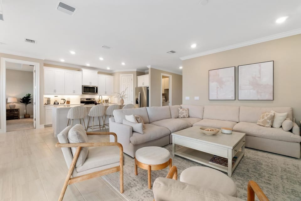 Cozy sectional couch, two additional chairs with ottomans